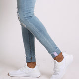 Light Wash Skinny Jeans With Signature Hem