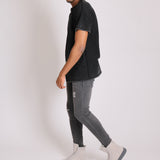 Logan Stretch Skinny Jeans In Washed Black With Distressing