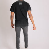 Logan Stretch Skinny Jeans In Washed Black With Distressing