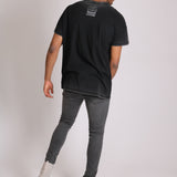 Logan Stretch Skinny Jeans In Washed Black With Distressing