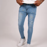 Logan Stonewash Paint Splatter Skinny Jeans