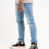 Logan Stretch Skinny Distressed Denim in Indigo Stonewash