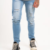 Logan Stretch Skinny Distressed Denim in Indigo Stonewash