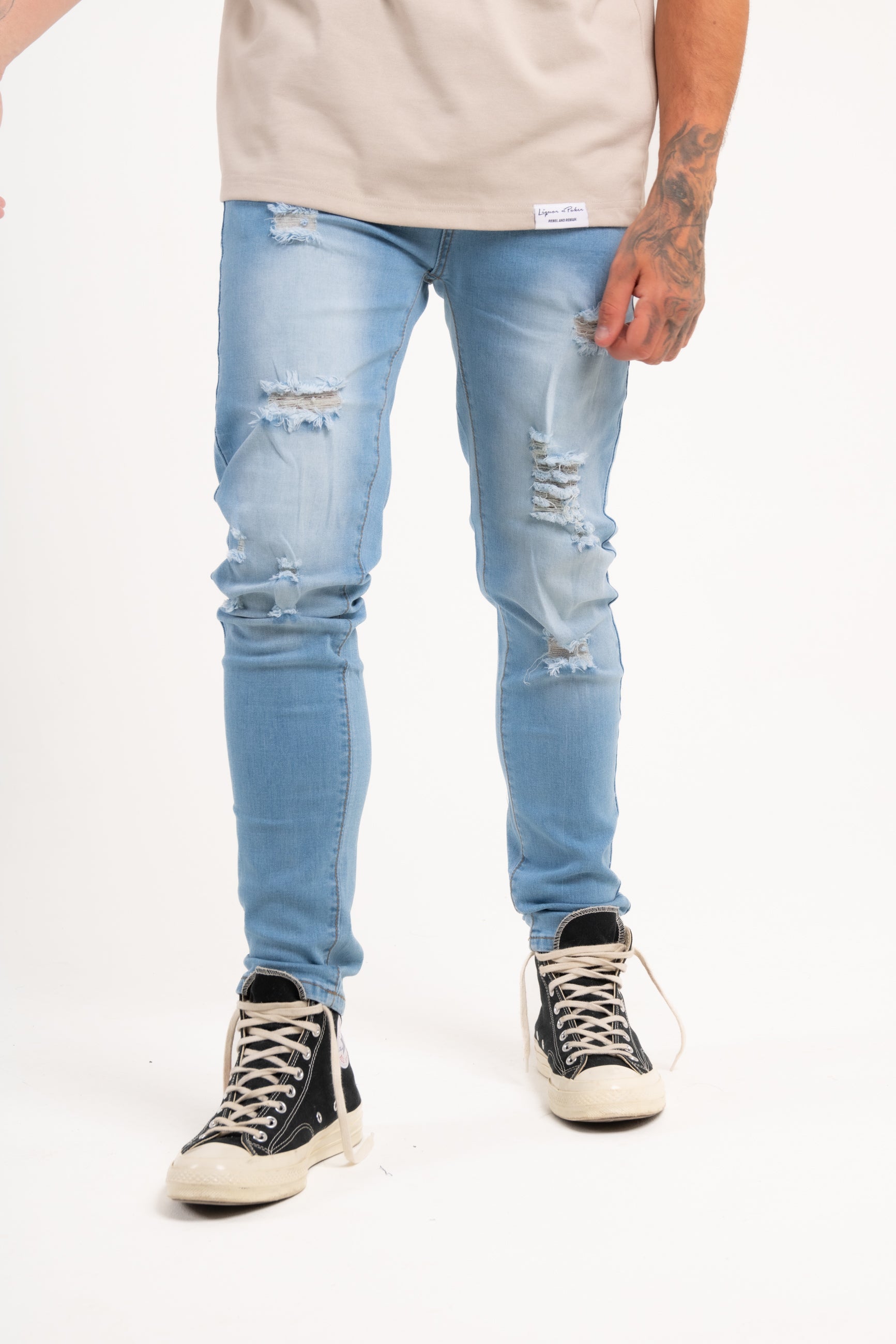 Logan Stretch Skinny Distressed Denim in Indigo Stonewash