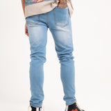 Logan Stretch Skinny Distressed Denim in Indigo Stonewash