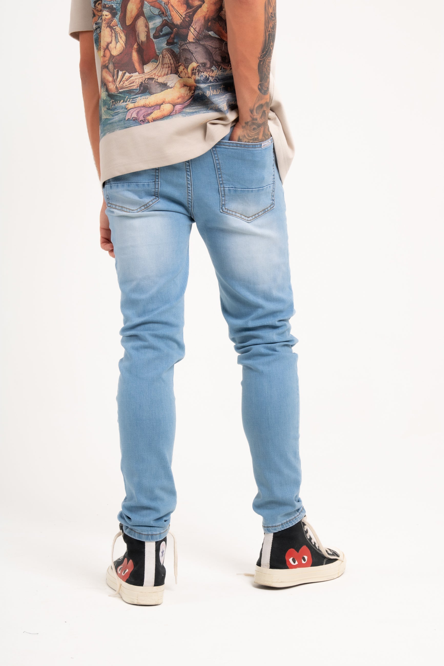 Logan Stretch Skinny Distressed Denim in Indigo Stonewash