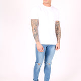 Logan Skinny Stretch Jeans In Light Stonewash With Ripped Knee