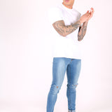 Logan Skinny Stretch Jeans In Light Stonewash With Ripped Knee